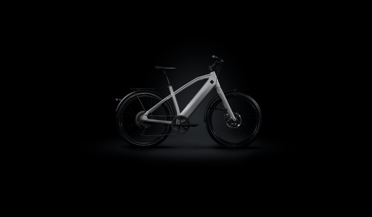 Stromer OMNI upgrade for Stromer ST1 models from October 2021: ST1 e-bike in light grey against black background.  
